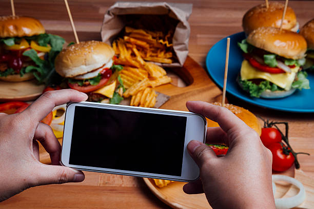 istock Hamburgers with moblie phone 496548582