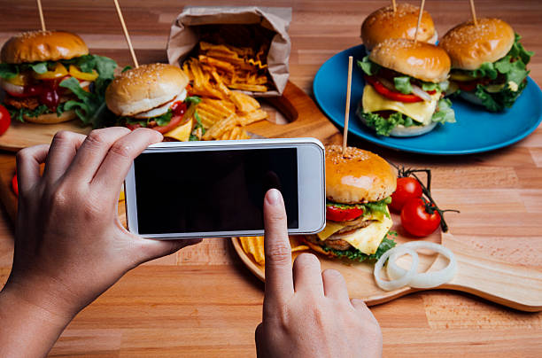 istock Hamburgers with moblie phone 496548598