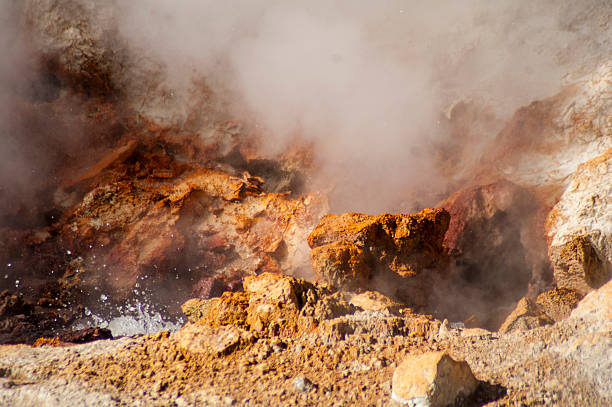 istock Steamy Geyser with Orange Rocks 496550578