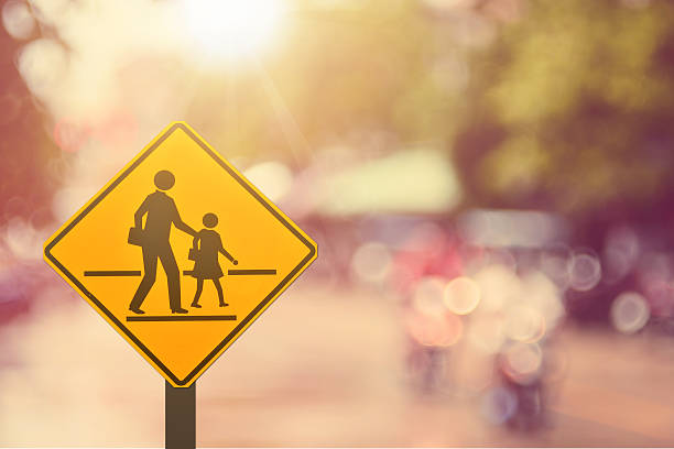istock School sign.Traffic sign road on blur road abstract background. 496554122