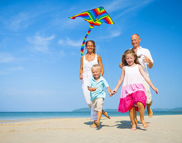 istock Family Running on the Beach 496558421