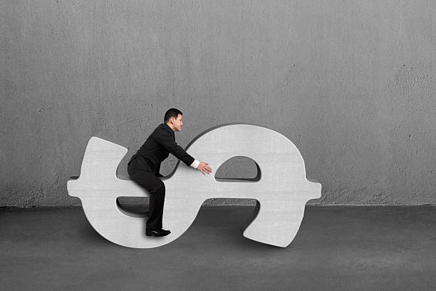 istock Riding on concrete money symbol 496558463