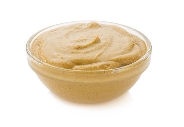 istock mustard sauce in bowl on white 496559631