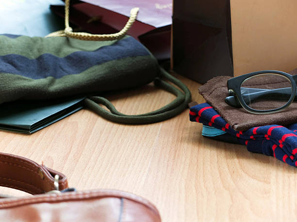 istock Newly bought clothes and eyeglass packed out at home 496560595