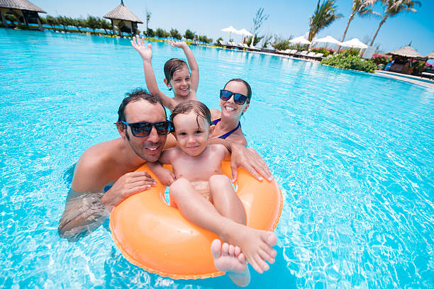 in piscina - cheerful swimming pool happiness resort swimming pool foto e immagini stock