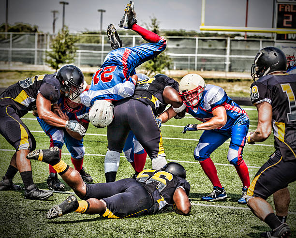 istock Football Player Dives to Make First Down 496563167