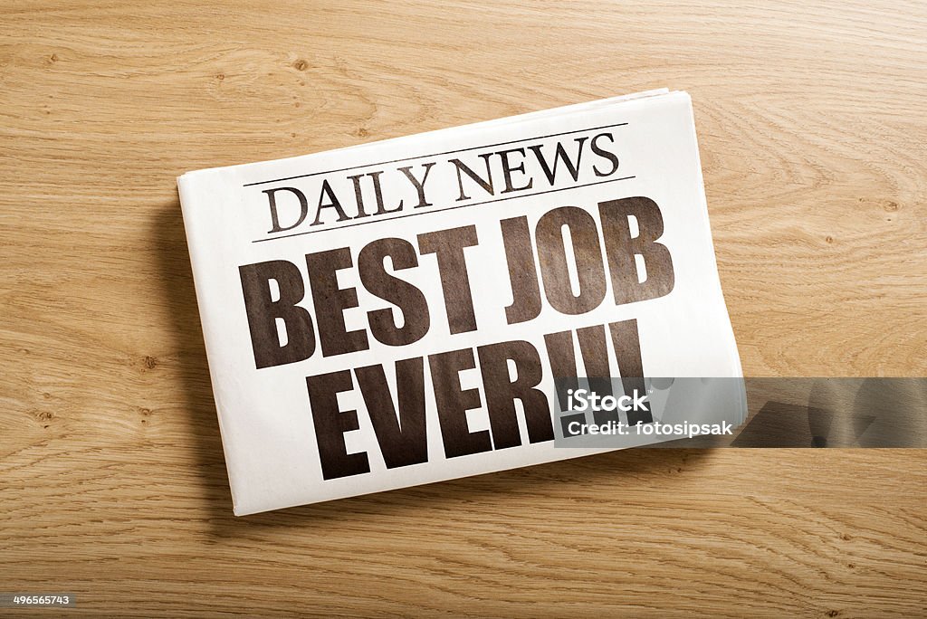 best job ever custom made newspaper on the table Achievement Stock Photo