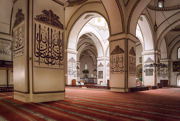 Bursa Grand Mosque, Turkey Bursa Grand Mosque or Ulu Cami was built between 1396 and 1399. The medieval drawings on the columns are arabic scripts which are words and verses from holy Quran. ulu camii stock pictures, royalty-free photos & images
