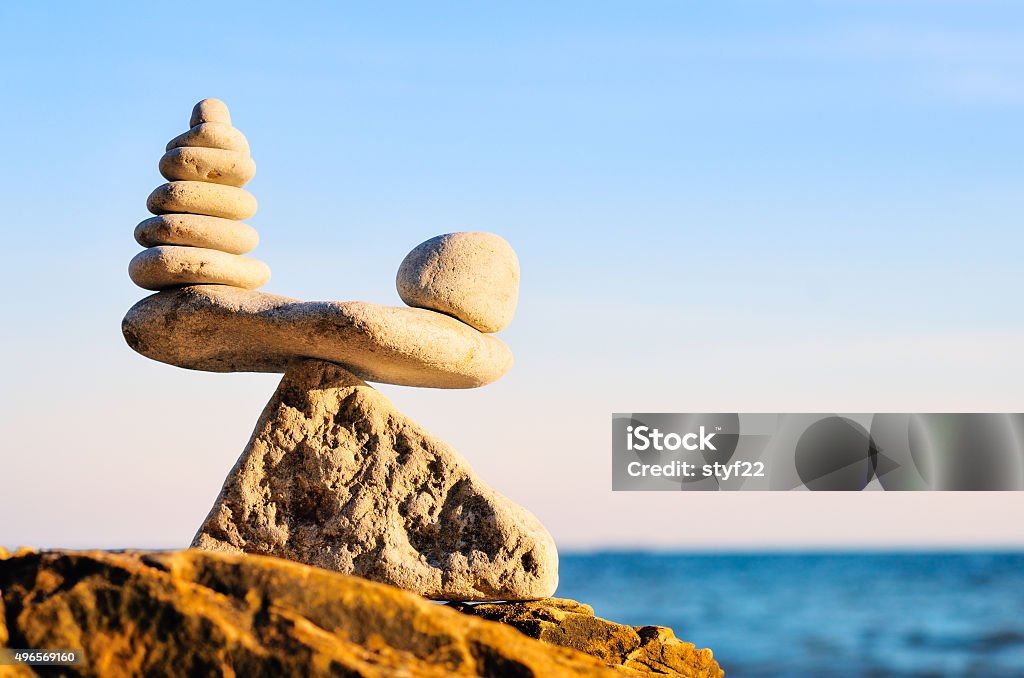 Equability of stones Stack of zen stones in balance at seashore 2015 Stock Photo