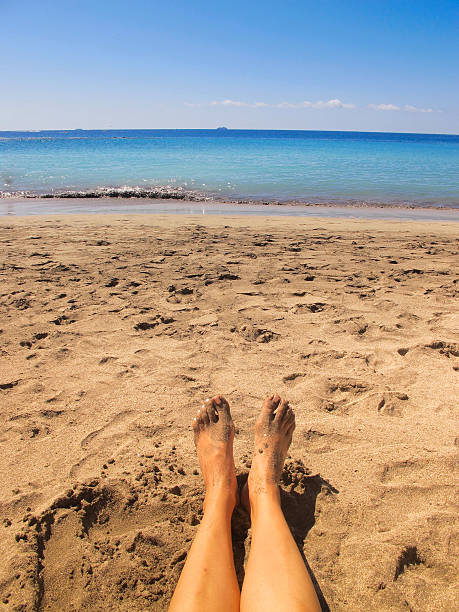 istock Low Section of Woman on a Beach 496569344