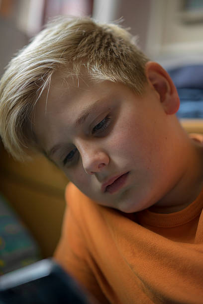 istock Pensive attractive young teenage boy 496569896