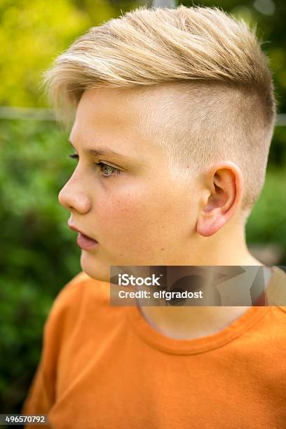 Young Teenage Boy With A Modern Hairstyle Stock Photo - Download Image Now  - 2015, Arts Culture and Entertainment, Beautiful People - iStock