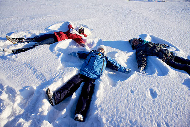 istock Family snow angels 496571070