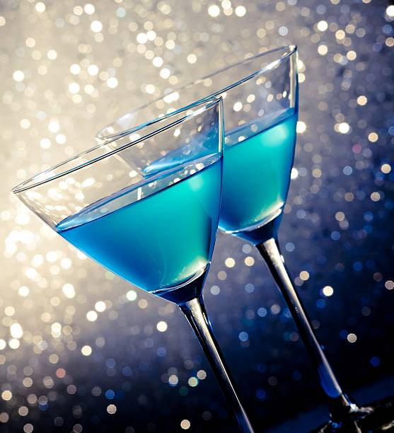 istock two glasses of blue cocktail on table 496572612