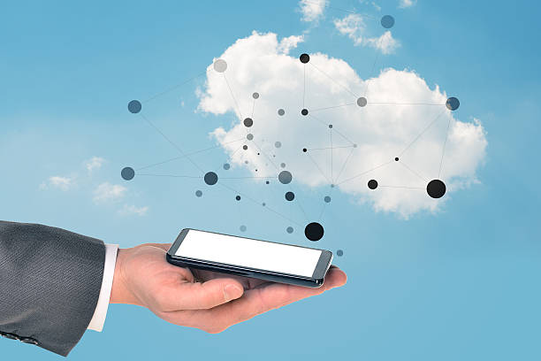 istock Businessman arm with smartphone 496576836