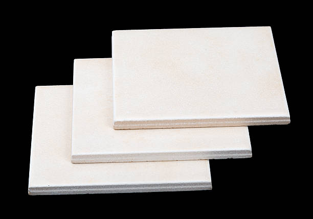 istock Pile of tiles on black background, side view 496577118