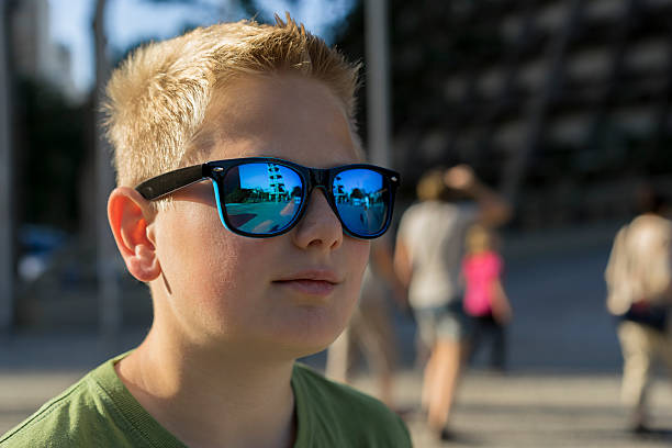istock Young boy wearing trendy sunglasses 496578752