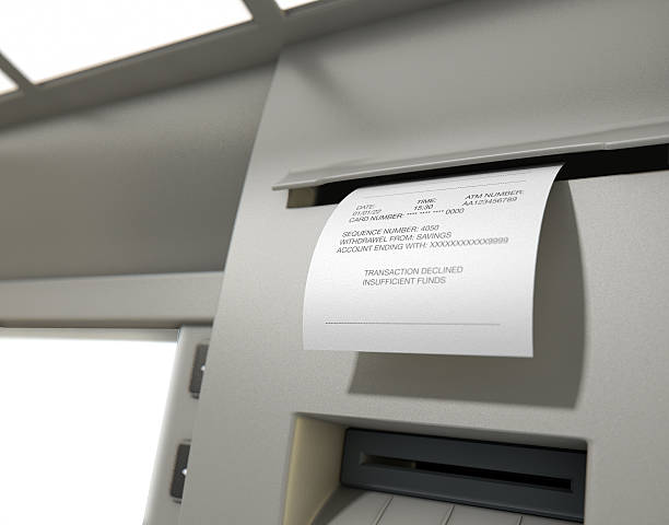 ATM Slip Declined Receipt A closeup view of the slip printing section of an atm with a declined receipt insufficient funds stock pictures, royalty-free photos & images