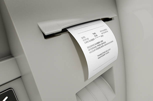 ATM Slip Declined Receipt A closeup view of the slip printing section of an atm with a declined receipt insufficient funds stock pictures, royalty-free photos & images