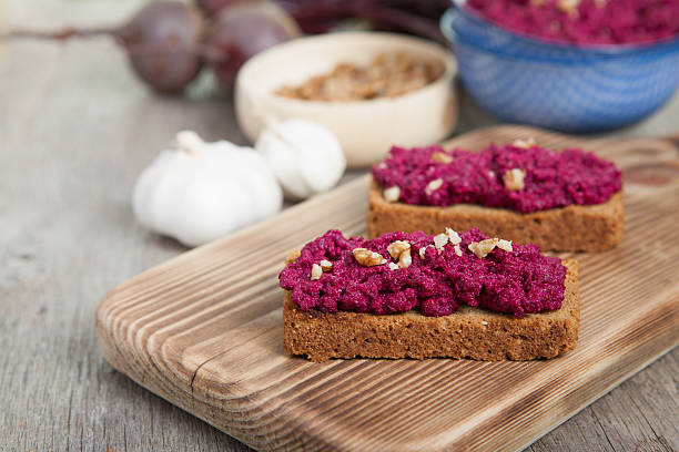 istock Beetroot pesto in a blue bowl on a wooden table 496581530