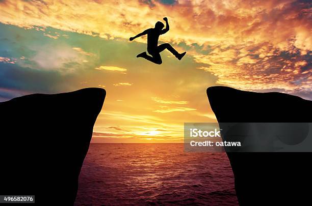 Man Jump Stock Photo - Download Image Now - Cliff, Jumping, Mountain