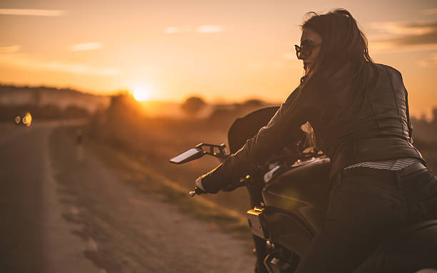 istock Biker girl on the road 496583094