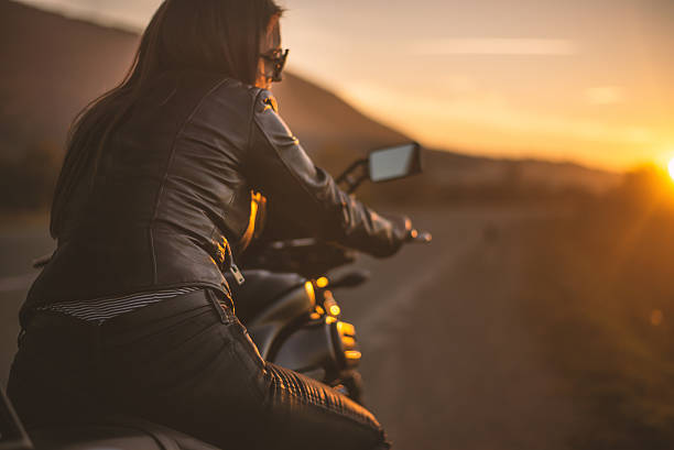 istock Biker girl on the road 496583294