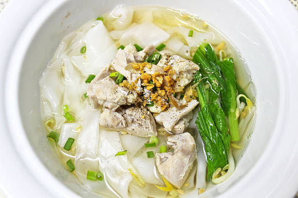 istock Rice noodle clear soup with chicken and canton leaf 496583341