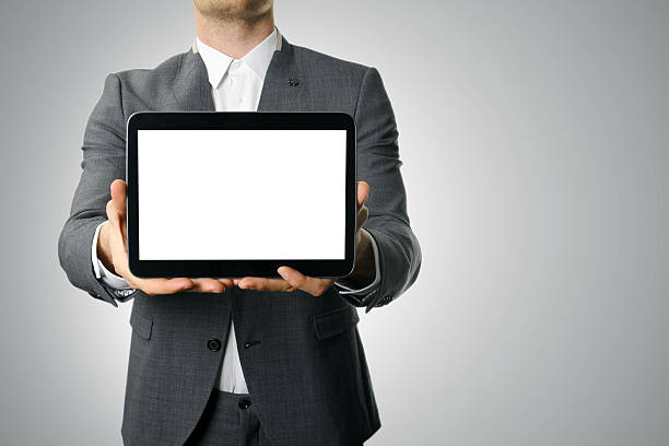 istock businessman showing blank digital tablet 496584017