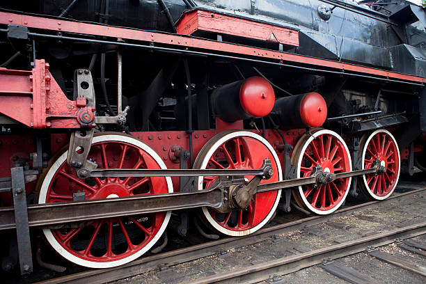 istock Red wheel on a steam train locomotive 496584037
