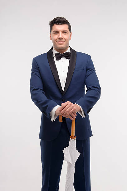 istock Fashion man with stick umbrella 496584683