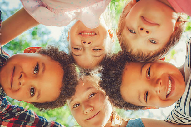 istock Low angle view of children in a park 496584865
