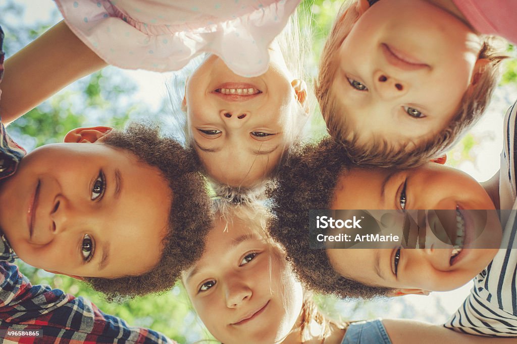 Low angle view of children in a park Cheerful multi-ethnic children in a park Child Stock Photo