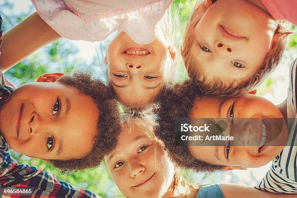 Low Angle View Of Children In A Park Stock Photo - Download Image Now - Child, Summer Camp, Playful