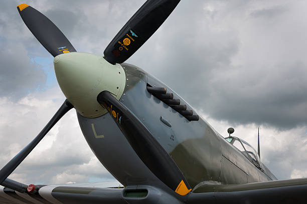 Spitfire propeller Duxford, UK - 25th May 2014: Close up of British Spitfire, classic WW2 fighter, at Duxford Airshow. spitfire stock pictures, royalty-free photos & images