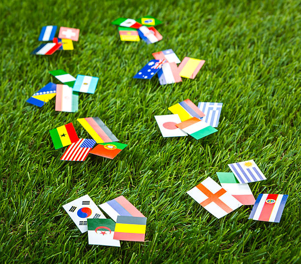 istock Paper cut of flags on grass 496586359