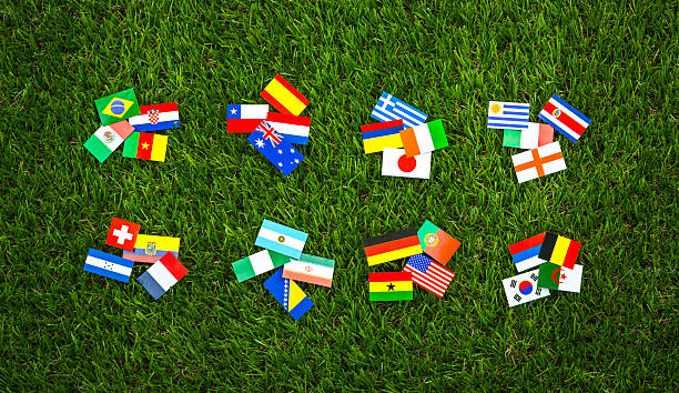 istock Paper cut of flags on grass 496586363