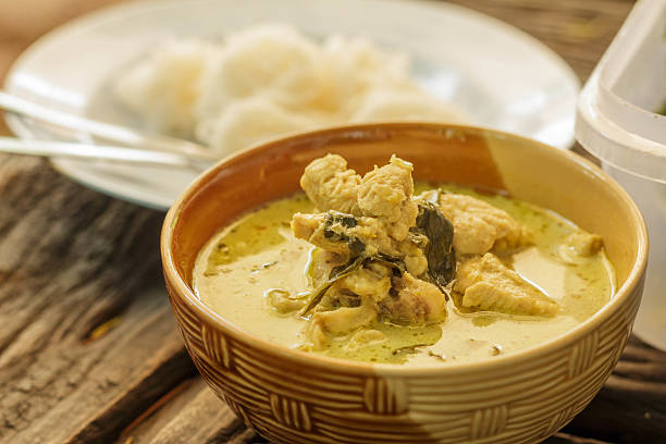 istock Thai green curry chicken intense soup and thai noodles 496587431