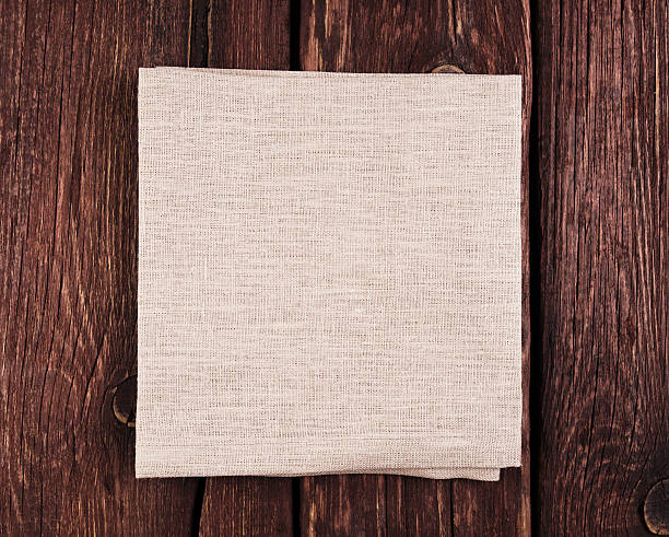 istock Texture canvas fabric on wooden background 496587999