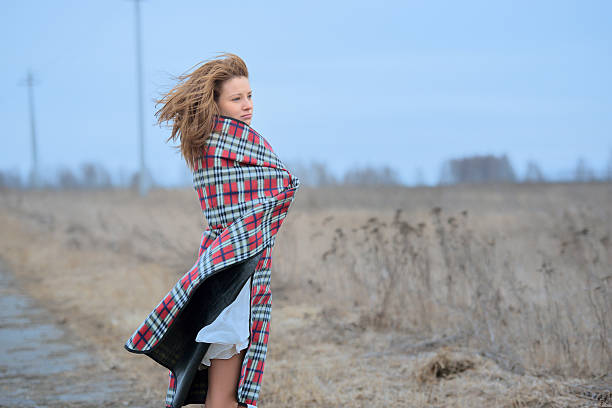 istock Woman in plaid with flying hair 496588655