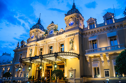 Monte Carlo, Monaco - June 3, 2014: Guests enter the world famous Monte Carlo Casino in Monaco.on an early June evening