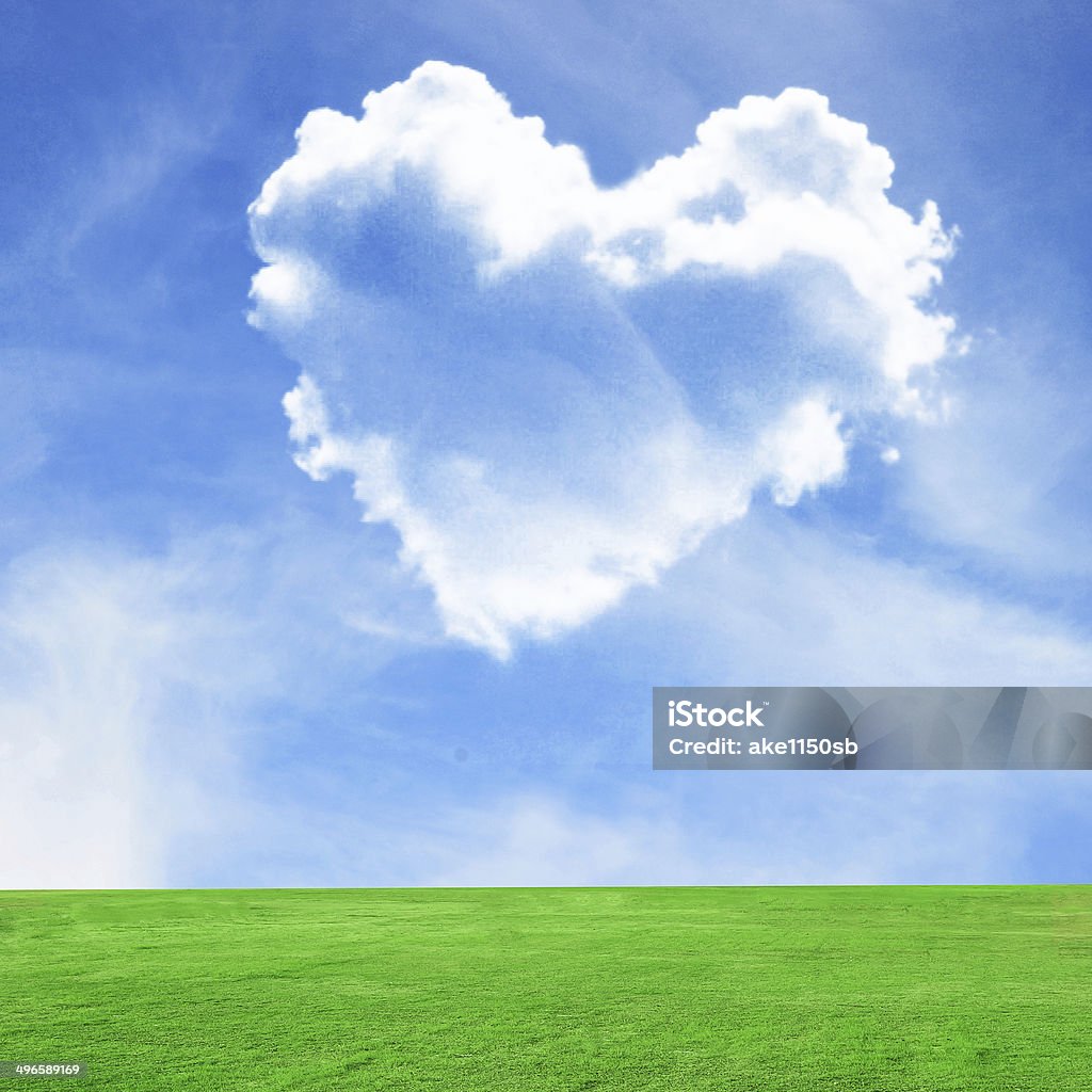 Picture of heart cloud on blue sky and green field Picture of a heart cloud on blue sky and green field Agricultural Field Stock Photo