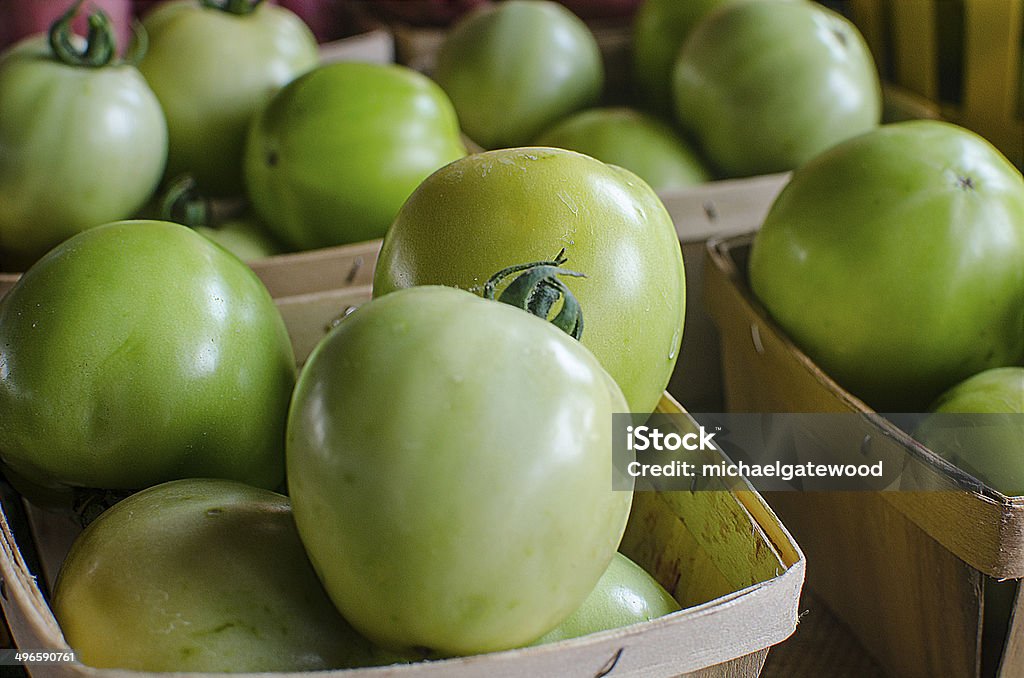 Green Tomatoes Organic Green Tomatoes in a Farmer's Market Food Stock Photo