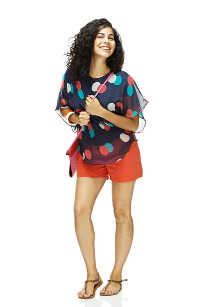 istock Smiling woman standing and looking at camera 496596767
