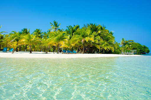 White beach and clear water on beautiful island Southwater Caye in Belize