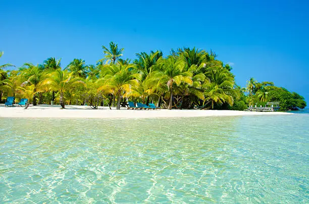 White beach and clear water on beautiful island Southwater Caye in Belize