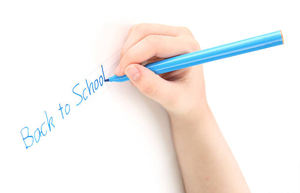 Preschool child tracing the words Back to School. Font used for tracing is my own design,