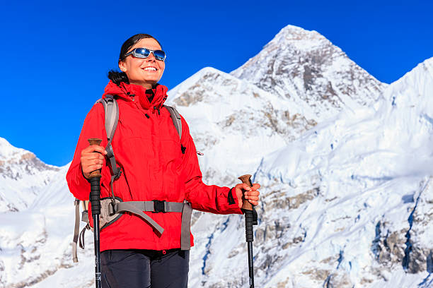 istock Female trekker looking over Himalayas, Mount Everest on a background 496599971