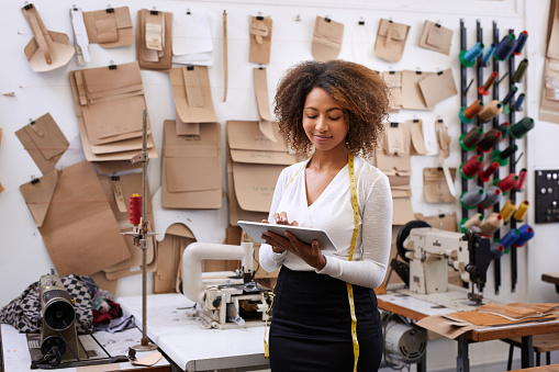 Shot of a fashion designer using her digital tablet in her workshophttp://195.154.178.81/DATA/i_collage/pu/shoots/805891.jpg