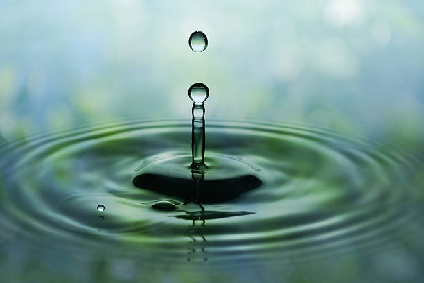 istock Falling green drops of water 496600253